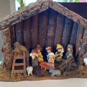 Wooden nativity scene, with plastic characters